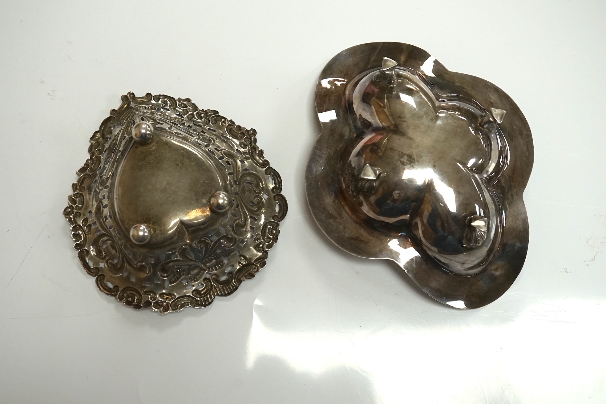 An Elizabeth II silver quatrefoil dish by James Dixon & Sons, Sheffield, 1967, 14.2cm, together with a silver spoon and pusher, silver bonbon dish, pair of silver wishbone nips and a cased set of plated spoons. Condition